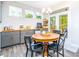Bright breakfast nook with wood table and access to backyard deck at 51 Riverbirch Way, Dallas, GA 30157