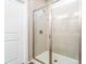 Walk-in shower with glass enclosure and neutral tile at 51 Riverbirch Way, Dallas, GA 30157