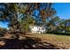Spacious backyard with mature trees and a large grassy area at 6055 Blackhawk Se Trl, Mableton, GA 30126
