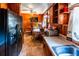 Kitchen with wood paneling and dining area at 6055 Blackhawk Se Trl, Mableton, GA 30126