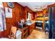Kitchen with wood paneling and appliances at 6055 Blackhawk Se Trl, Mableton, GA 30126