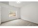 Bright basement bedroom with window and neutral carpet at 636 Ginger Cake Rd, Fayetteville, GA 30214