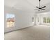 Large main bedroom with carpeted floor and multiple windows at 636 Ginger Cake Rd, Fayetteville, GA 30214