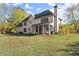 Two-story house with large backyard and covered patio at 7210 Wallace Tatum Rd, Cumming, GA 30028