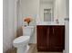 Small bathroom with dark wood vanity and shower/tub combo at 1142 Laurel Valley Ct, Buford, GA 30519