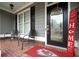 Front porch with seating area, decorative doormat, and welcoming sign at 143 Templeton Ln, Villa Rica, GA 30180