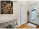 Bright entryway with hardwood floors, a glass door, and tasteful wall art at 143 Templeton Ln, Villa Rica, GA 30180