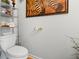 Small bathroom with a toilet and decorative shelving at 143 Templeton Ln, Villa Rica, GA 30180