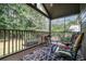 Relaxing screened porch with seating, grill and wooded view at 143 Templeton Ln, Villa Rica, GA 30180