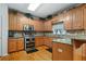 Spacious kitchen featuring granite countertops and stainless steel appliances at 143 Templeton Ln, Villa Rica, GA 30180