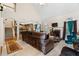 Spacious living room with vaulted ceilings, a fireplace, and large sectional sofa at 143 Templeton Ln, Villa Rica, GA 30180