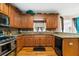 Kitchen boasts granite countertops, stainless steel appliances, and wood floors at 143 Templeton Ln, Villa Rica, GA 30180