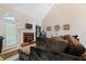 Living room with fireplace, sectional sofa, and access to back deck at 143 Templeton Ln, Villa Rica, GA 30180