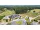 Aerial view of house on golf course with clubhouse and cart path at 143 Templeton Ln, Villa Rica, GA 30180