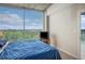 Bright bedroom with blue bedding and large windows showcasing scenic views at 3300 Windy Ridge Se Pkwy # 1121, Atlanta, GA 30339