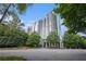 Modern high-rise building surrounded by trees and landscaping at 3300 Windy Ridge Se Pkwy # 1121, Atlanta, GA 30339