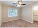 Spacious bedroom with ceiling fan and access to the bathroom at 1788 Danrich Dr, Decatur, GA 30032