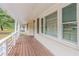 Inviting front porch with wooden floor and white railings at 1788 Danrich Dr, Decatur, GA 30032