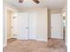 Spacious bedroom with double closets and neutral carpeting at 1788 Danrich Dr, Decatur, GA 30032