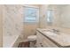 Updated bathroom with marble tile shower and granite countertop vanity at 1788 Danrich Dr, Decatur, GA 30032