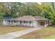 Charming brick ranch house with a spacious front yard at 1788 Danrich Dr, Decatur, GA 30032