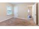 Well-lit bedroom featuring neutral carpeting and a door to hallway at 1788 Danrich Dr, Decatur, GA 30032