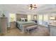 Main bedroom with large bed, plenty of natural light, and access to a deck at 176 Northmill Pkwy, Stockbridge, GA 30281