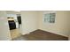 Dining area with wood-look floors and kitchen access at 5595 Marbut Rd, Lithonia, GA 30058