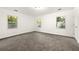 Bright bedroom with neutral colored carpet and multiple windows at 831 Mercury Nw Dr, Atlanta, GA 30331