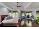 Large main bedroom with hardwood floors, a coffered ceiling, and a built in office at 1870 Mayfield Rd, Alpharetta, GA 30009