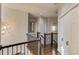 Upper hallway with dark hardwood floors and neutral walls at 1870 Mayfield Rd, Alpharetta, GA 30009