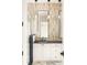 Modern bathroom with a walk-in shower, dark vanity, and marble-look tile at 1184 Lupo Loop, Chattahoochee Hills, GA 30268