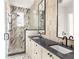 Spa-like bathroom with double vanity, walk-in shower, and marble tile at 1184 Lupo Loop, Chattahoochee Hills, GA 30268