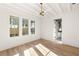 Spacious bedroom with hardwood floors and access to en-suite bathroom at 1184 Lupo Loop, Chattahoochee Hills, GA 30268
