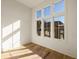 Bright bedroom with hardwood floors and large windows offering natural light at 1184 Lupo Loop, Chattahoochee Hills, GA 30268