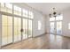 Spacious dining area with hardwood floors and access to an outdoor patio at 1184 Lupo Loop, Chattahoochee Hills, GA 30268