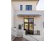 Exterior of a charming townhome with white brick and black windows at 1184 Lupo Loop, Chattahoochee Hills, GA 30268