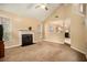Open living room with a fireplace and kitchen views at 4103 Kingship Dr, Ellenwood, GA 30294