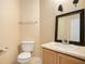 Simple bathroom with vanity, toilet and mirror at 4103 Kingship Dr, Ellenwood, GA 30294