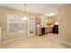Eat-in kitchen with light wood cabinets and black appliances at 4103 Kingship Dr, Ellenwood, GA 30294
