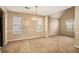Bright dining room with neutral walls and carpeting at 4103 Kingship Dr, Ellenwood, GA 30294