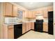 Galley kitchen with ample storage and black appliances at 4103 Kingship Dr, Ellenwood, GA 30294