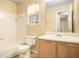 Full bathroom with shower/tub combo, vanity, and tile flooring at 4103 Kingship Dr, Ellenwood, GA 30294
