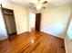 Hardwood floor bedroom with closet and ceiling fan at 85 Sears Rd, Covington, GA 30016