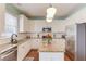 Modern kitchen with stainless steel appliances and granite countertops at 615 Timber Ives Dr, Dacula, GA 30019