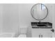 Modern bathroom with marble tile and floating vanity at 555 Versailles Dr, Auburn, GA 30011