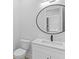 Elegant bathroom with marble vanity and a large mirror at 555 Versailles Dr, Auburn, GA 30011