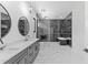 Modern bathroom with double vanity and marble floors at 555 Versailles Dr, Auburn, GA 30011
