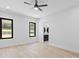 Bright bedroom with ceiling fan and large windows at 555 Versailles Dr, Auburn, GA 30011