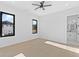 Bright bedroom with hardwood floors and ceiling fan at 555 Versailles Dr, Auburn, GA 30011